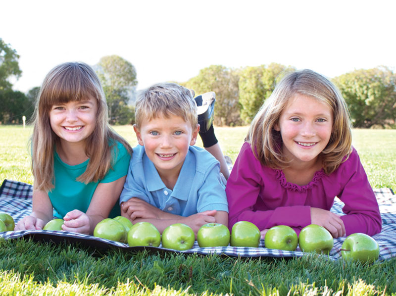 boy and girls with apples