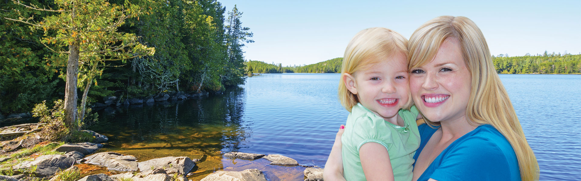 mother and daughter by lake